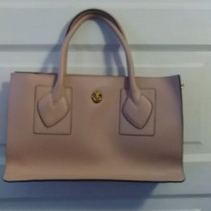 A pretty girly hand bag withe strap